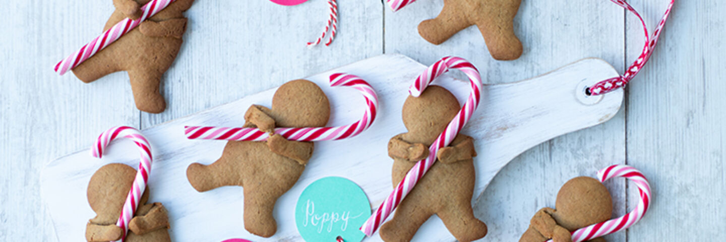 Cuddling candy cane gingerbread men