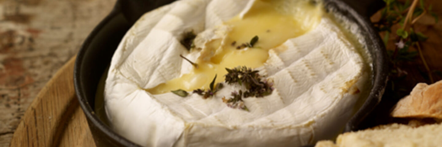 Baked cheese with cranberries and walnuts