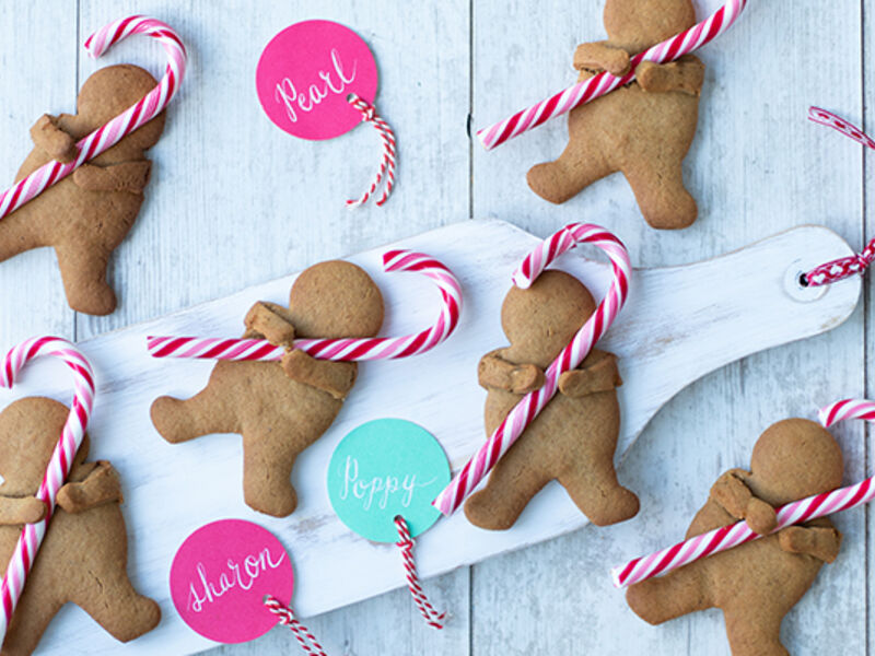 Cuddling candy cane gingerbread men