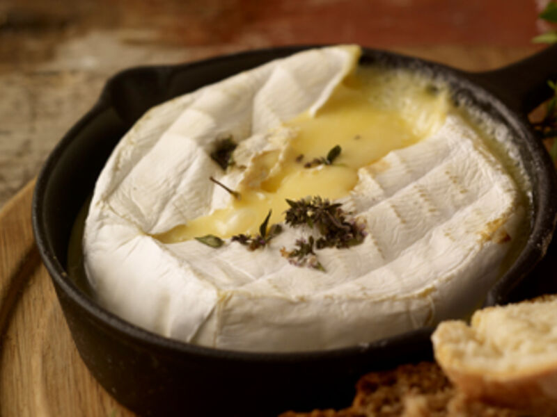 Baked cheese with cranberries and walnuts